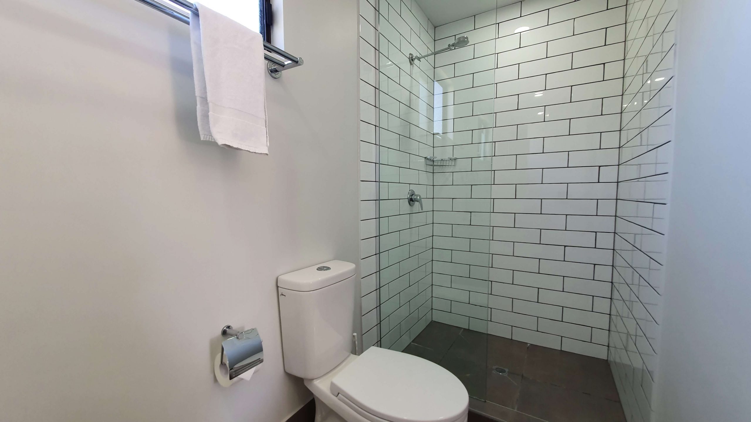 Shower and toilet in Bathroom of Superior Double Cabin at Alex Beach Cabins